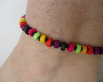 Anklet Rainbow Bone Beads. 1/4" in Disc beads. Bright Colors. Adjusts in Size from a minimum of 8.5" up to 14". Waterproof.. Non Metal.