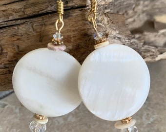 Shell Earrings. White mother of Pearl disc beads with tiny white crystals and puca shells. Gold plated ear wires and accent beads. 1” W. 2”L