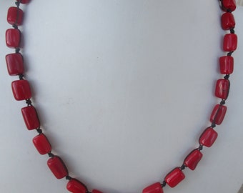 Red Coral Necklace. Hand Knotted on Brown Cord. Non Metal.  Coral  Beads are 1/2 inch. Waterproof. Adjusts in Size from a 22" up to 30".