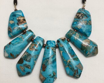 Necklace Turquoise Impression Jasper. Rectangle Gemstone Pieces. 2" L. 1.5"W. Double Dark Brown Suede Strands . 16”L. Extending another 1.5”