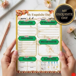 Könnte beinhalten: Ein Tagesplaner mit dem Titel "My Exquisite Day" mit Abschnitten für Absichten, Aufgaben, Zeitplan, Essensplanung und Wellness-Tracking. Der Planer hat ein florales Design mit goldenen Akzenten.