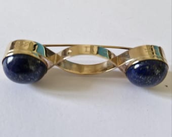 Broche em forma de fita de Möbius