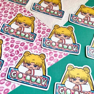 May include: A set of five stickers featuring a cartoon character with blonde hair and a blue dress. The character is making a grumpy face and the stickers say "Go Away" in a colorful, bubbly font.