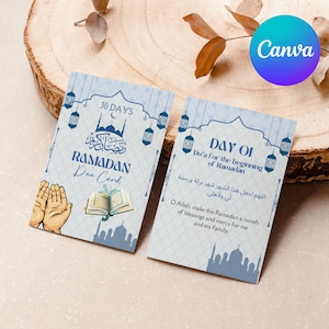 May include: A blue and white Ramadan Dua Card with a 30 days title and a prayer for the beginning of Ramadan. The card features a mosque, lanterns, and open hands with a book.