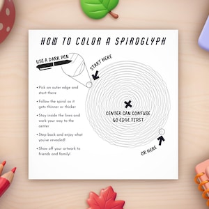 Peut inclure: Une feuille de papier carr&eacute;e blanche avec des instructions sur la fa&ccedil;on de colorier un spirographe, entour&eacute;e de crayons de couleur, d'un bol pour chien et de feuilles d&eacute;coratives. Le texte dit "Comment colorier un spirographe".