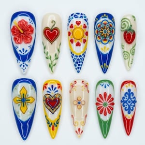 May include: A set of ten long, almond-shaped artificial nails, each hand-painted with unique, colorful designs. The designs include floral patterns, hearts, crosses, and geometric shapes, with a variety of colors including red, blue, yellow, and green.