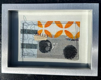 Mixed media artwork in a silver metal frame with an easel back or with free standing option