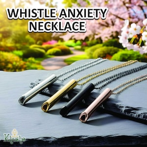 May include: Whistle anxiety necklaces in silver, gold, black, and rose gold. Each necklace features a cylindrical pendant with a whistle design, suspended from a ball chain. The image includes the text "WHISTLE ANXIETY NECKLACE".
