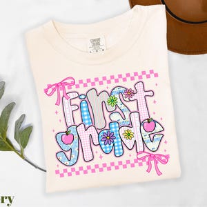 a t - shirt with the words first time on it