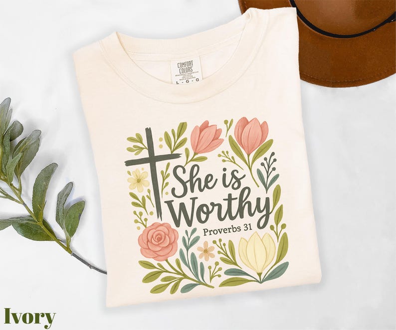 a t - shirt with a cross and flowers on it