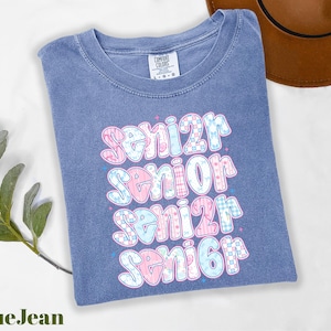 a t - shirt with the words senior senior on it