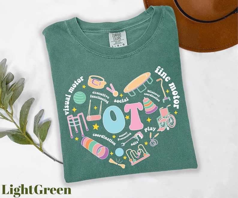 a green t - shirt with a heart shaped design