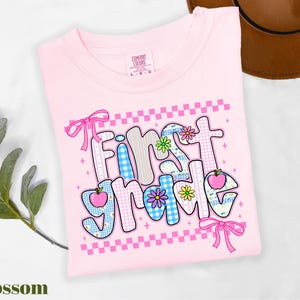 a pink shirt with the words first time on it