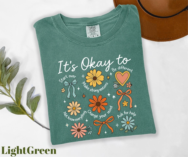 a t - shirt that says it's okay to be different