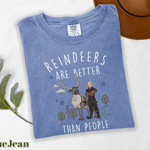 a blue tshirt with a picture of a man and a woman on it