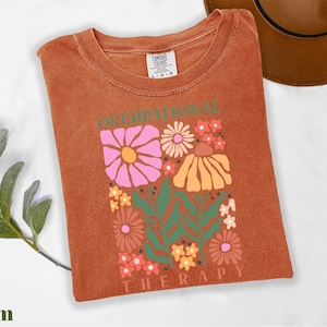 a t - shirt with a picture of flowers on it
