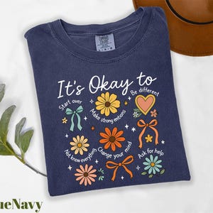 a t - shirt that says it's okay to be different