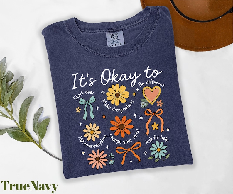 a t - shirt that says it's okay to be different