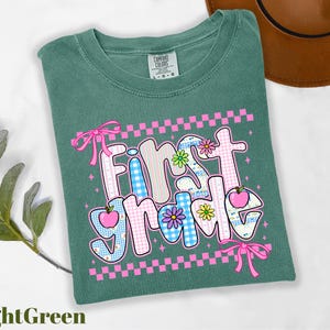 a t - shirt with the words first home on it