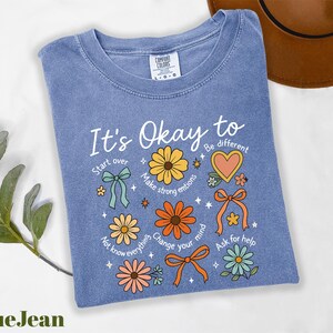 a t - shirt that says it's okay to be different