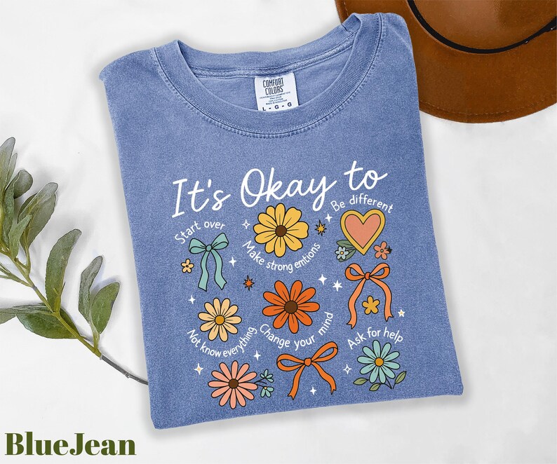 a t - shirt that says it's okay to be different