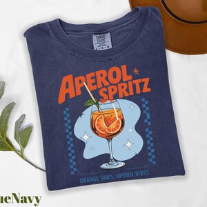 a t - shirt with an orange slice on it