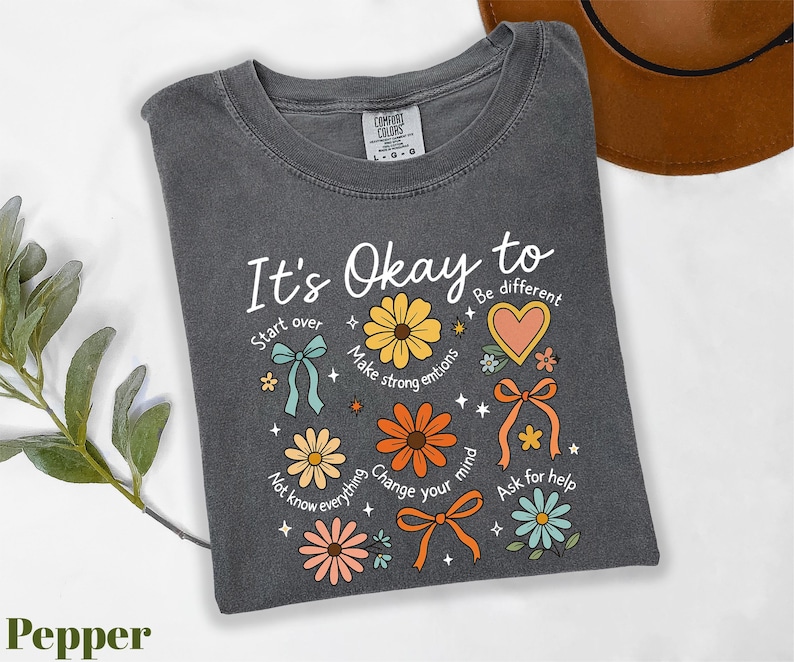 a t - shirt that says it's okay to be different