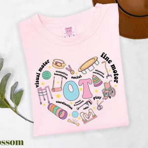 a pink t - shirt with the words happy birthday written on it