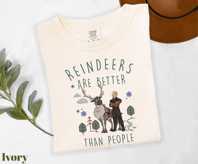 a white t - shirt with reindeers are better than people on it