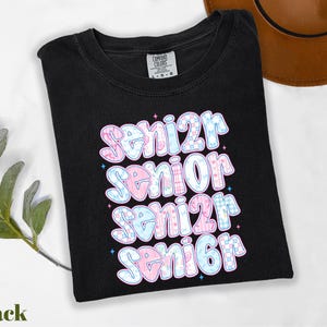 a black t - shirt with the words senior senior senior senior on it