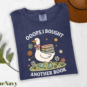 a t - shirt with a duck reading a book