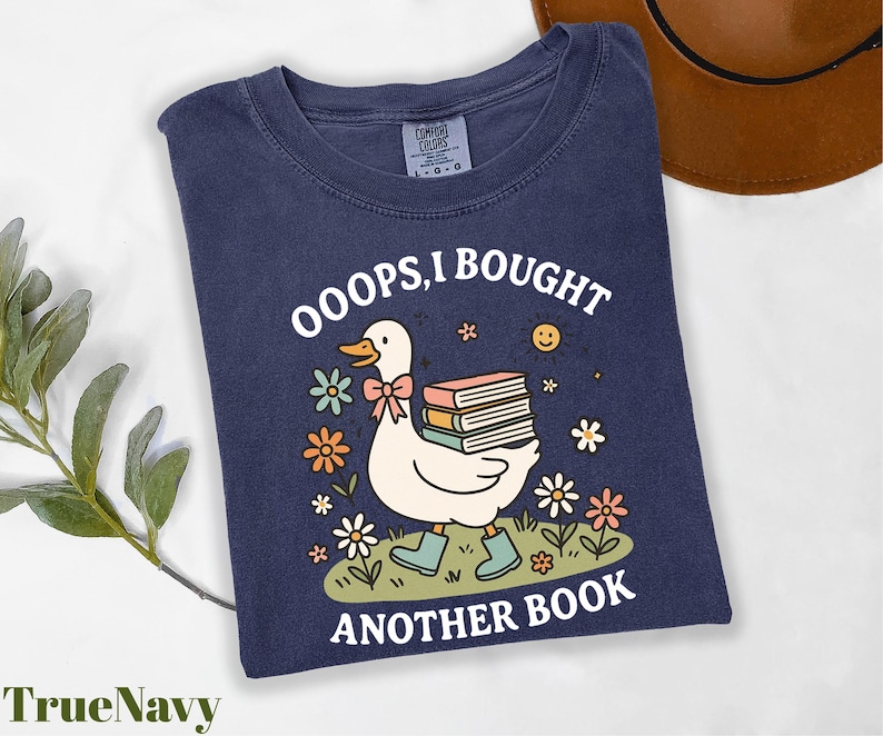 a t - shirt with a duck reading a book