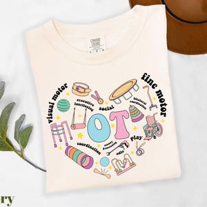 a t - shirt with a heart shaped design on it