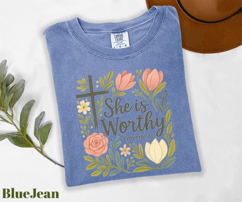 a t - shirt with a cross and flowers on it