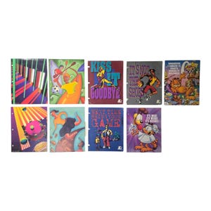 May include: A collection of vintage Starter brand notebooks with colorful illustrations and text. The notebooks feature various sports and cartoon themes, including Garfield and a dog with science goggles.