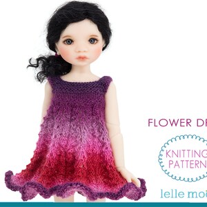 May include: Knitting pattern for a flower dress for a doll. The dress is a gradient of purple, pink, and red.