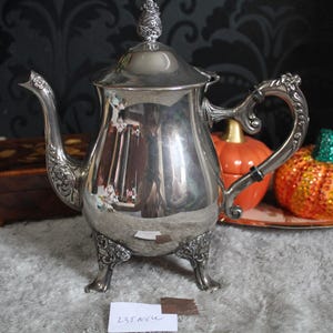 Vintage Silver Plated Teapot Coffee Pot Ornate Handle Legs Antique Home Decor Perfect for Serving Tea Coffee Classic Style Unique Gift Idea