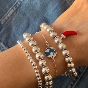 Bracelet Carte du Monde, Bijou Élégant pour Voyageuse, Cadeau Original pour Elle, Anniversaire ou Cadeau pour Pilote