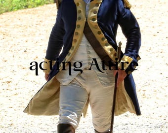 May include: A navy blue and gold military-style coat with gold buttons and trim. The coat is worn over a white vest and pants. The image also shows black boots and a sword. The text "acting Attire" is visible.