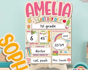 May include: A wooden sign with the name "AMELIA" in pink, designed for the last day of 1st grade. It includes spaces for personal details like age (6 years), height (45 inches), favorite color (pink), and teacher's name (Mrs. Sarah).