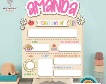 May include: A wooden first and last day of school sign with the name "Amanda" in pink. The sign has spaces to fill in details like date, teacher, and favorite color. Decorative elements include flowers, an apple, and books.