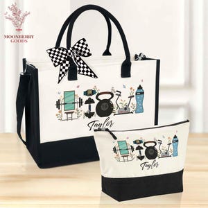 May include: A white and black tote bag and matching cosmetic bag. The bags feature a black base and handles, with a personalized design of gym equipment, flowers, and the name "Taylor". A checkered bow adorns the tote.