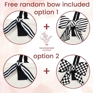 May include: Two tote bags with black and white striped bows. The text "Free random bow included" and "option 1" and "option 2" are visible. The text "Moonberry Goods" is also visible.