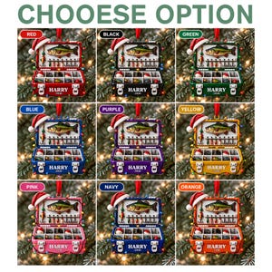 May include: A collection of nine tackle box ornaments in red, black, green, blue, purple, yellow, pink, navy, and orange. Each box features a Santa hat, a fish graphic, fishing lures, and the text HARRY 2026 printed on the front latch area.