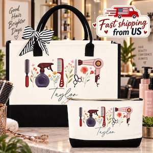 May include: A white and black canvas tote bag and matching zippered pouch, both featuring a graphic print of hair styling tools, floral accents, and the name Taylor in black script. A black and white striped bow is attached to the tote bag handle.