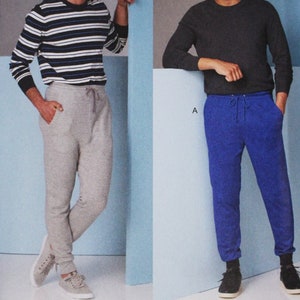 May include: Vogue Patterns sewing pattern for men's pants, pattern number V1854, size MXX (40-42-44-46). The pattern shows two models wearing different colored pants, one in gray and one in blue.