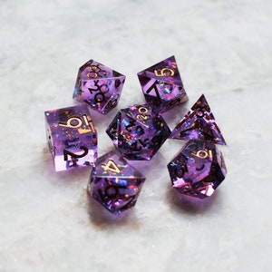 Strangelight, purple polyhedral sharp edge DnD gem dice holographic iridescent