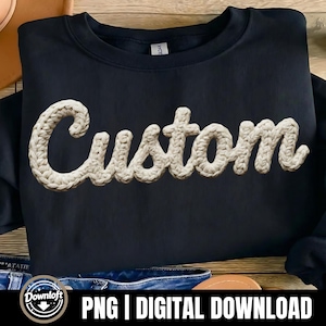 May include: Navy blue sweatshirt with the word "Custom" in a cream-colored, crocheted font. The sweatshirt is folded on a wooden surface. The bottom of the image includes the text "PNG | DIGITAL DOWNLOAD".