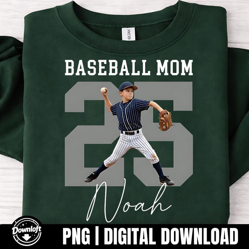 May include: Dark green sweatshirt featuring the text "BASEBALL MOM" above a grey number "25" and the name "Noah" in white script. The number "25" has a photo of a boy in a baseball uniform. The bottom of the sweatshirt has the text "PNG | DIGITAL DOWNLOAD".