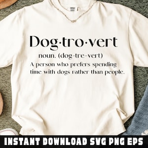 May include: Cream-colored t-shirt with the word "Dog-tro-vert" in large black letters. The definition of the word is printed below. The phrase "INSTANT DOWNLOAD SVG PNG EPS" is printed at the bottom.